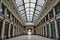 Glass and iron roof of an empty covered passage in Milan