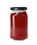 Glass jar with adjika sauce isolated on white. Pickling and preservation