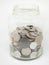 Glass jar Coin Thai,Pile of coins heap of coins silver gold,Stacks on a white background,Investment money concept, Coin stack grow