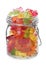 Glass jar with delicious jelly bears on white