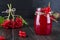 Glass jar of Delicious viburnum jam with fresh berries