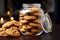 Glass jar filled with flourless peanut butter oatmeal chocolate chip cookies
