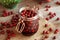 Glass jar filled with fresh hawthorn berries and red wine - preparation of medicinal wine