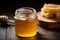 glass jar filled with raw, unfiltered honey