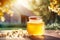 Glass jar with flower honey on wooden table with blooming apple branches