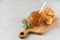 Glass jar with fruity orange jam with croissants on a grey background. Fruit preservation.