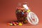 Glass Jar full of bright colorful lollies and candy with open lid