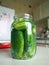 Glass jar full of cucumder for home preservation