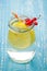 glass jar of lemonade with a lemon and red berries/glass jar of