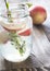 Glass jar of lime water with slices of peach