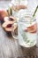 Glass jar of lime water with slices of peach