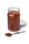 Glass jar and metal spoon with red sambal, Indonesian chilli sauce, on white background