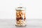 Glass jar of mixed nuts including almonds cashews and pistachios, natural healthy pantry ingredients