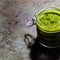 Glass jar of pesto sauce