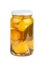 Glass jar with pickled yellow tomatoes
