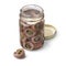 Glass jar with rolled anchovy and capers on white background close up