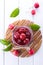 Glass jar of small paradise apple jam with fresh fruits on white table. top view