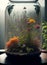 A glass jar terrarium filled with many flowers