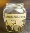 Glass jar with the word down payments. Payment used in the context of the purchase of expensive items such as a car and a house,