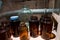 Glass jars and bottles with blood spattered wall in stained laboratory with glass case