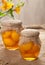 Glass jars with healthy canned peaches compote natural preserved fruits