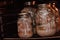 Glass jars with a stewed pork in hot oven. Homemade cooking with a traditional recipe, Ukrainian cuisine