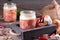 Glass jars with a stewed pork on a wooden background. Homemade cooking with a traditional recipe, Ukrainian cuisine