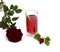 Glass of juice of currant and red rose