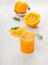 Glass of juice, squeezed orange and citrus press