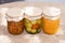 Glass jurs of various preserved, canned foon in the kitchen in sunny day