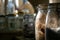 Glass Kilner jars full of provisions in a country kitchen pantry.