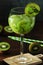 A glass with kiwi cocktail