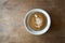 Glass of latte coffee on wooden table