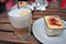 Glass of latte and tiramisu cake