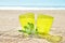 Glass of lemonade on sand, cocktail on beach