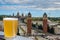 Glass of light beer against view of Spain Square Placa d`Espanya in Barcelona, Spain. Aerial view of Placa d`Espanya with