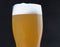 glass of light beer with foam. Bright refreshing alcoholic drink