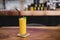A glass of Mango Smoothies, refreshing beverages,  serve on the wooden desk