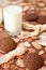Glass of milk and cookies on dark napkin with image of hearts