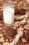 Glass of milk and cookies on dark napkin with image of hearts