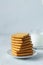 Glass of milk and cookies.stacks of tasty cookies on the white plate.