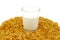 Glass of milk and corn flake cereals on a white