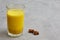 Glass of milk with curcumin, turmeric. Golden milk enhances antiviral protection. Health and antioxidants concept.