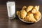 Glass of milk and fresh croissants on wooden table