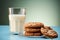 A glass of milk perfectly complements a serving of warm oatmeal cookies