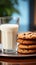 A glass of milk perfectly complements a serving of warm oatmeal cookies
