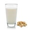 Glass of milk and toasted pistachios on white backgroun