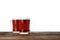 Glass mugs of delicious kvass on wooden table