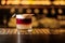 Glass of a New York sour cocktail on the steel wooden bar counter