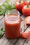 Glass of nutritious tomato juice and fresh tomatoes